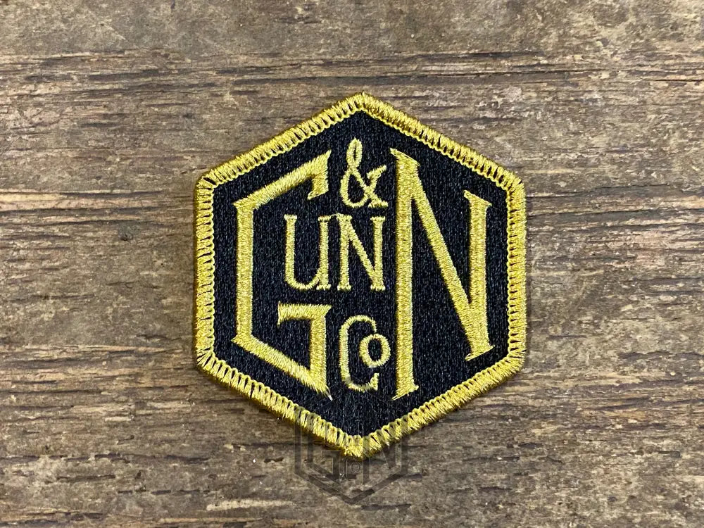 Gunn & Co Gold And Black Embroidered Cloth Badge. Badge