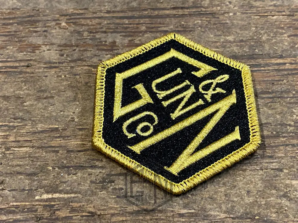 Gunn & Co Gold And Black Embroidered Cloth Badge. Badge