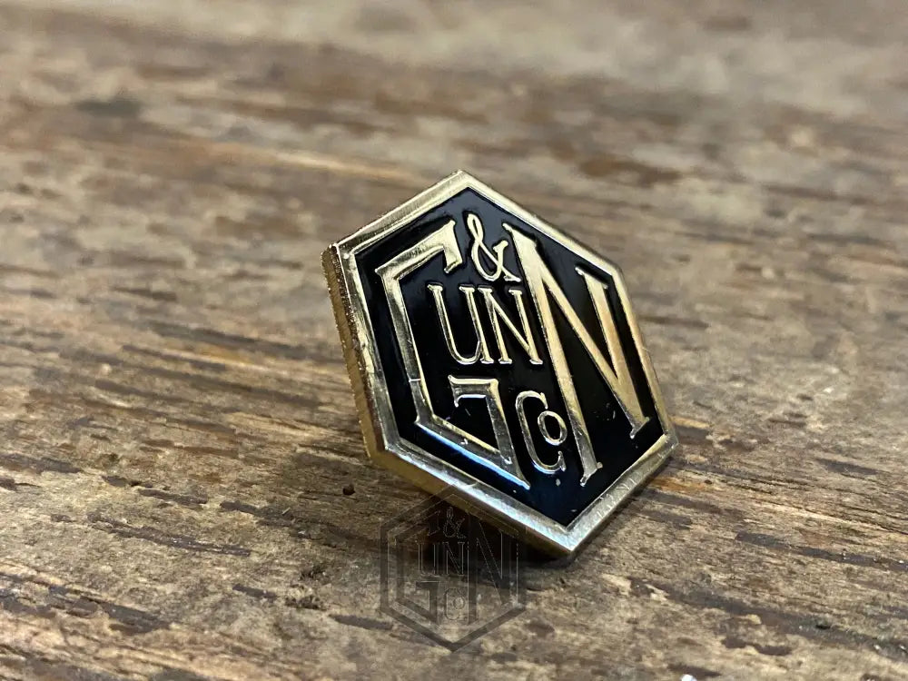 Gunn & Co Gold And Black Enamel Lapel Pin Badge. Badge