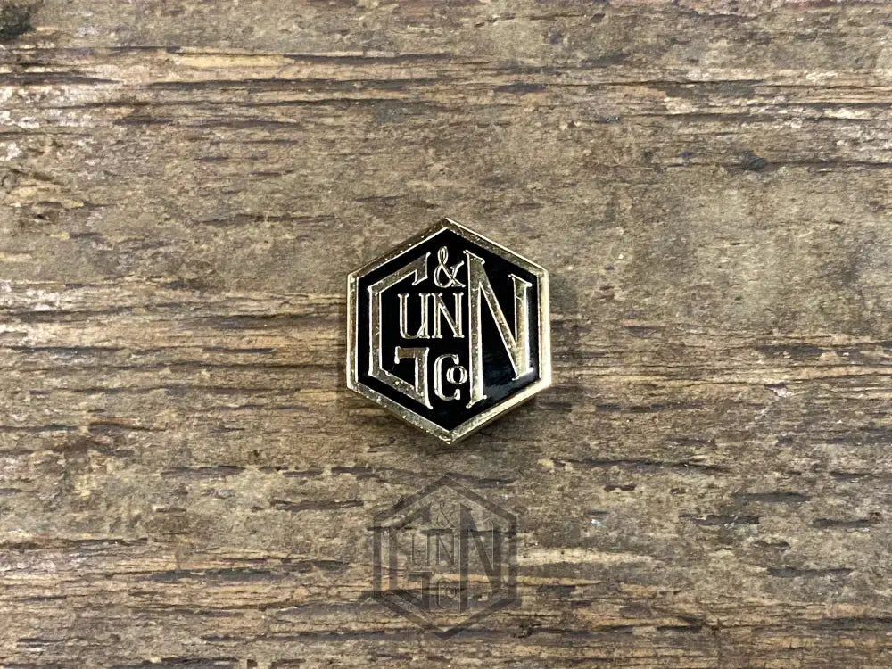 Gunn & Co Gold And Black Enamel Lapel Pin Badge. Badge